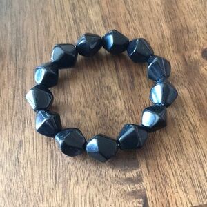A black nugget like bracelet.. in good condition